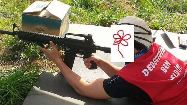 İzcilik kampında çocuklara atış talimi yaptırılmış