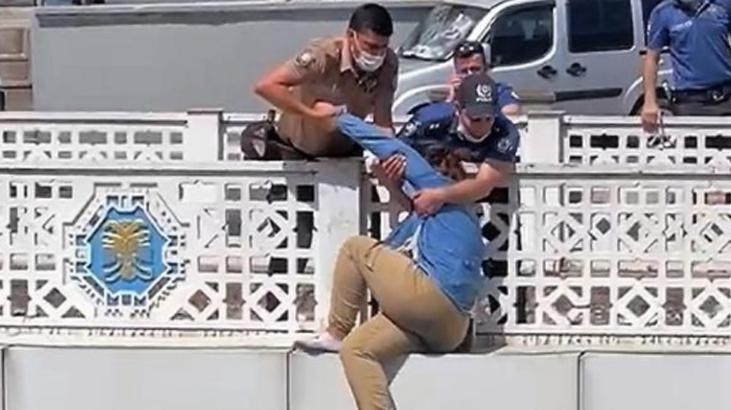 Genç kızın intiharını önleyen polisler, yere çelik yeleklerini serdi