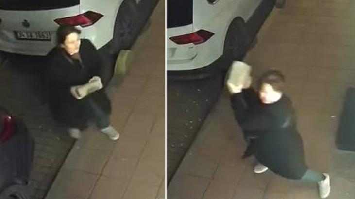 Kaldırım taşıyla öfke saçtı! Gece yarısı iş yerinin önüne gelen kadın camları tuzla buz etti