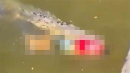 Nehirde timsah kaptı! Ağzında cesetle yüzerken görüntülendi