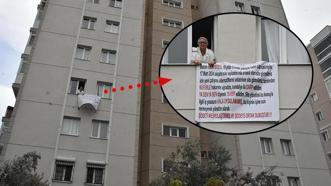 İzmir'de yaşadığı apartmanda saldırıya uğradı! Sesini duyurmak için pankart astı