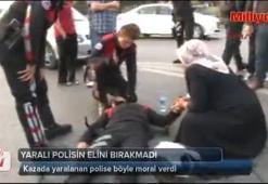 Yaralı polisin elini bırakmadı