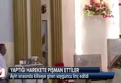 Ayin sırasında kiliseye giren soyguncuya dayak
