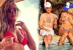 Heidi Klum havuz başında üstsüz güneşlendi