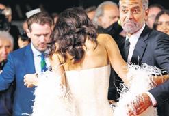 Clooney eşinin imdadına koştu