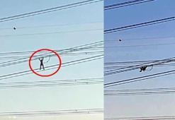 Yüksek gerilim hattında, personelin akrobatları aratmayan bakım çalışması kamerada