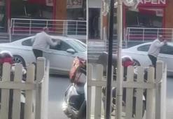 Otomobile kaldırım taşı ile saldırdı, camı kıramayınca uzaklaştı