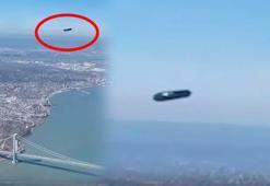 Uçağın camında UFO belirdi! Ne olduğu tespit edilemedi, şehrin üzerinde şok görüntü