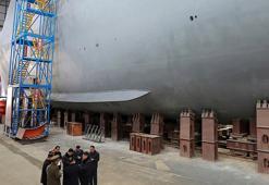 Kuzey Kore'den dünyayı tedirgin eden nükleer denizaltı hamlesi! Kim Jong-un başında böyle poz verdi