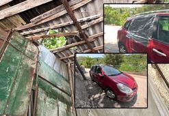 Garaj çatısına çıkan kurbanlık boğa, otomobilin üzerine düştü