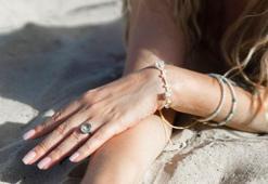 Parmaktaki alyansın bile düşmanı! Meğer güneş kremi masum değilmiş, karartıyor