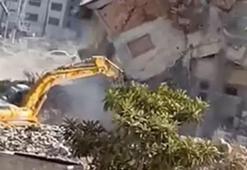 Yıktığı binanın altında kalmaktan saniyelerle kurtuldu