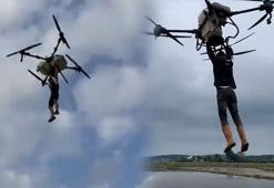 Çeltik tarlasında akılalmaz anlar! Tutunduğu dronla havalandı: Düşme anı kamerada