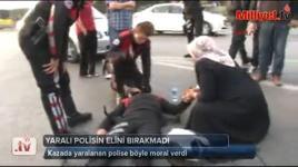 Yaralı polisin elini bırakmadı