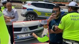 Plakasını bantla kapatan baba ve oğlu polis ablukaya aldı! Şoke eden savunma