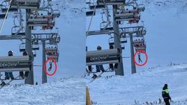 Düşen snowboardını almak için atlamaya çalıştığı telesiyejde asılı kaldı