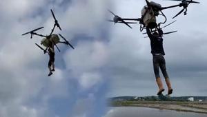 Çeltik tarlasında akılalmaz anlar Tutunduğu dronla havalandı: Düşme anı kamerada