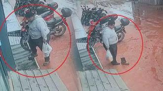 Çamurlu ayakkabısını çıkartıp, market alışverişini öyle yaptı