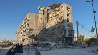 İsrail'in Dahiye'de Karz-ı Hasen şubelerinin bulunduğu binalara saldırılarının ardından oluşan yıkım görüntülendi