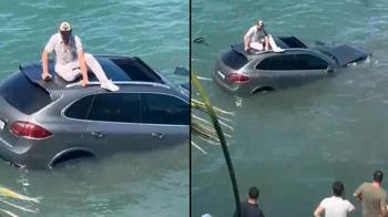 Denize uçtu, batan aracın üzerinde kurtarılmayı bekledi