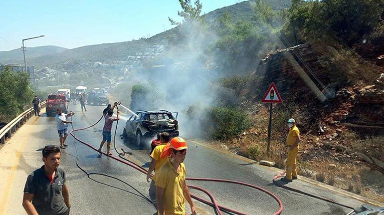 Otomobildeki yangın, ormana sıçramadan söndürüldü