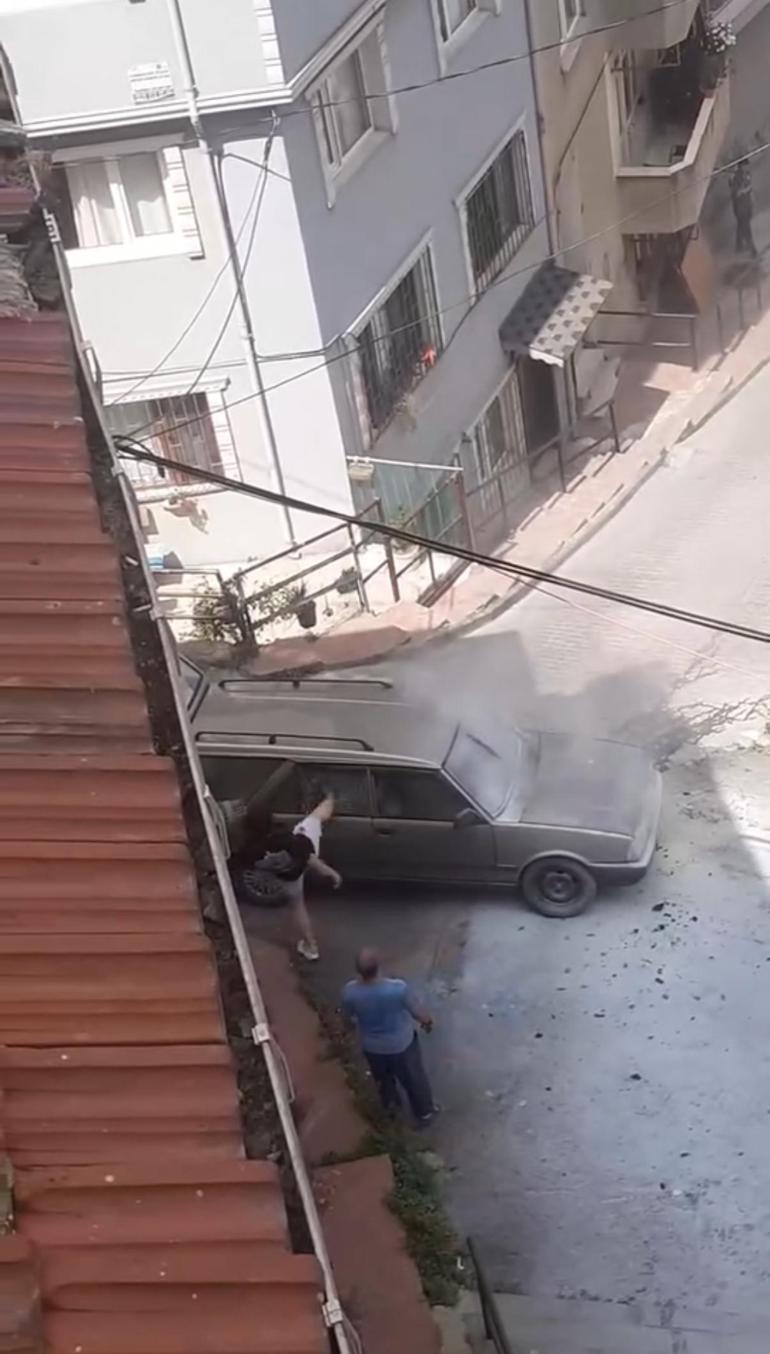 Aracı yanan sürücü öfkeden cam ve aynaları kırdı