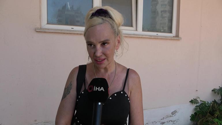 68822675ba1ad627b368ea34 Kedisi içerdeyken evi yanan Ukraynalı kadın polisin kucağına bayıldı
