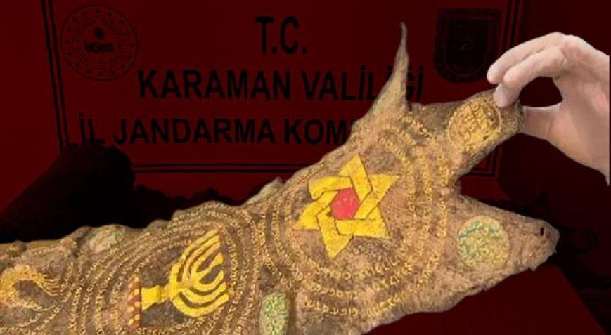 Otomobil takibe alındı, ortaya çıktı: Piton derisine işlenmiş eser