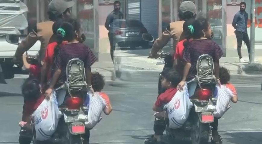 Adana’da sıradan bir gün 6 kişinin bindiği motosiklette çocuklar çuvalla taşındı